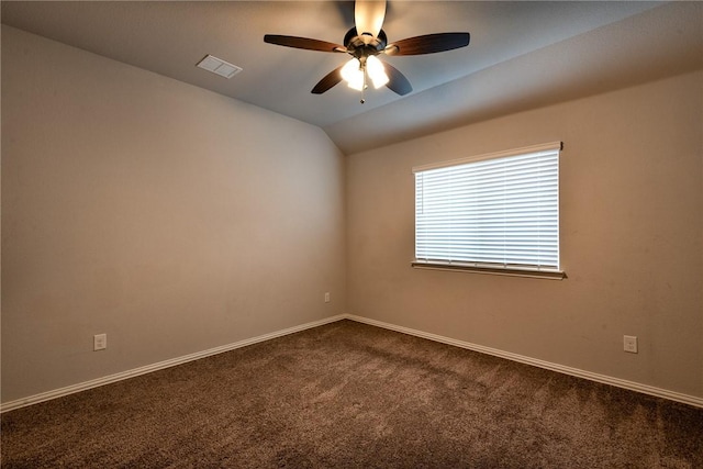 carpeted empty room featuring ceiling fan and lofted ceiling