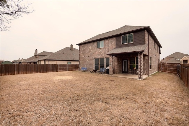 back of property featuring a patio area