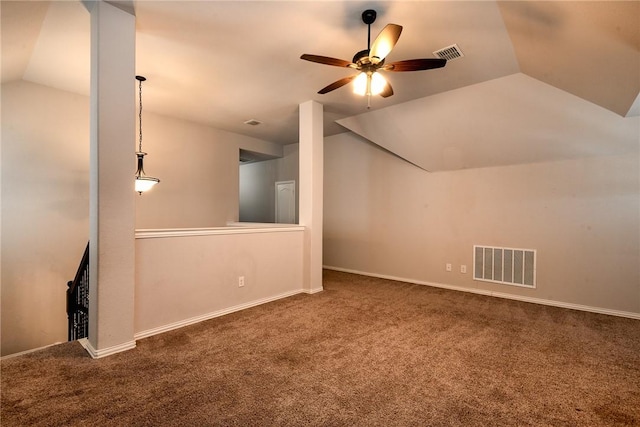 additional living space with ceiling fan, vaulted ceiling, and dark carpet