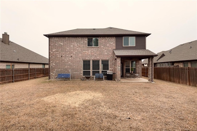 back of property featuring a patio