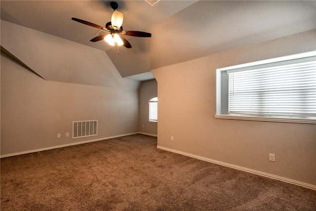 additional living space featuring carpet, vaulted ceiling, and ceiling fan