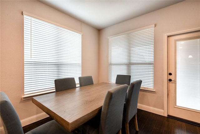 dining area featuring dark hardwood / wood-style flooring