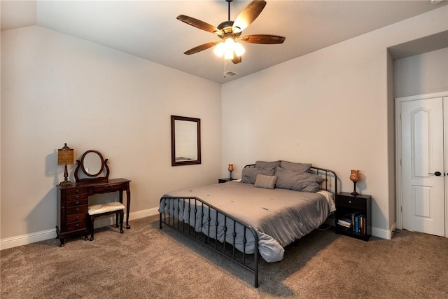 carpeted bedroom with vaulted ceiling and ceiling fan