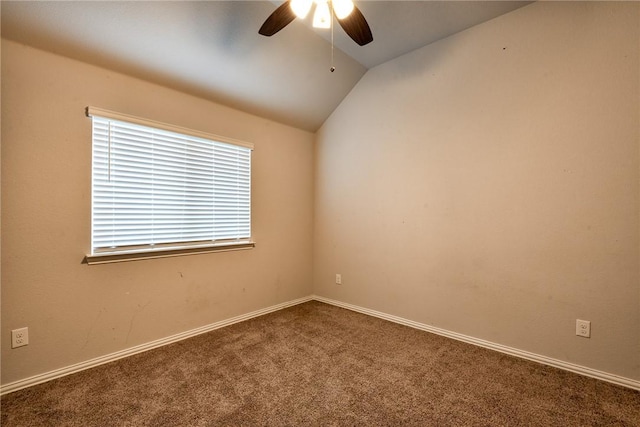 carpeted spare room featuring ceiling fan and lofted ceiling