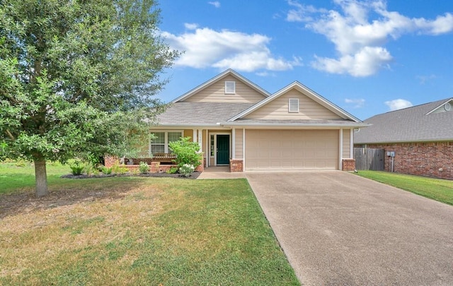 view of front of house with a garage and a front lawn