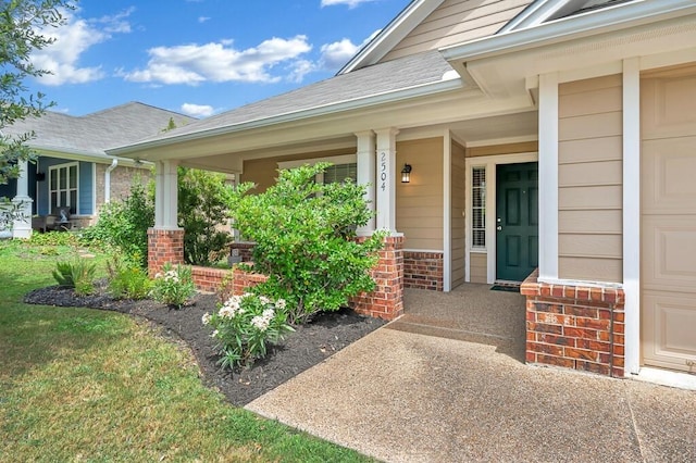 entrance to property featuring covered porch