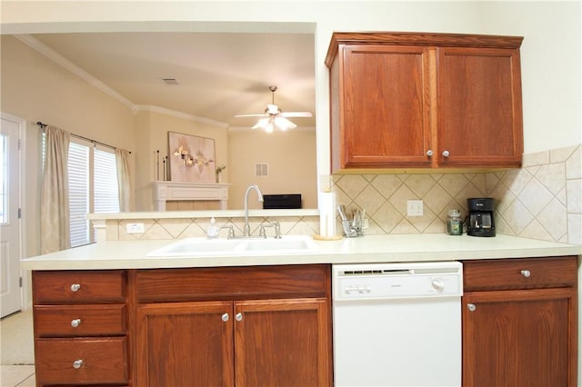 kitchen with ceiling fan, sink, kitchen peninsula, white dishwasher, and ornamental molding