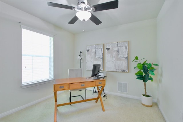 home office featuring ceiling fan and carpet floors