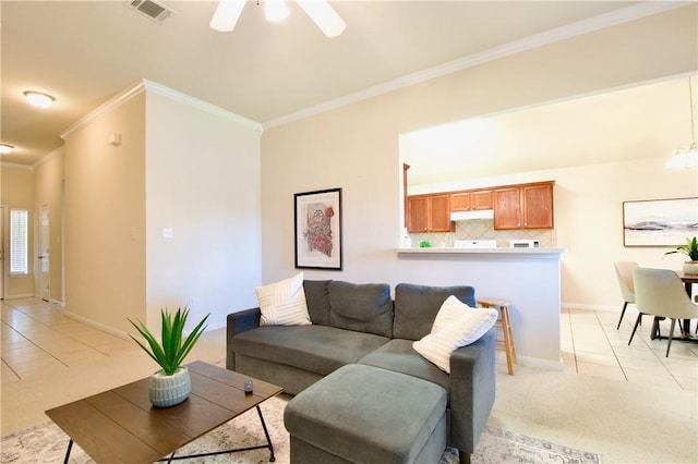 carpeted living room featuring ceiling fan with notable chandelier and crown molding