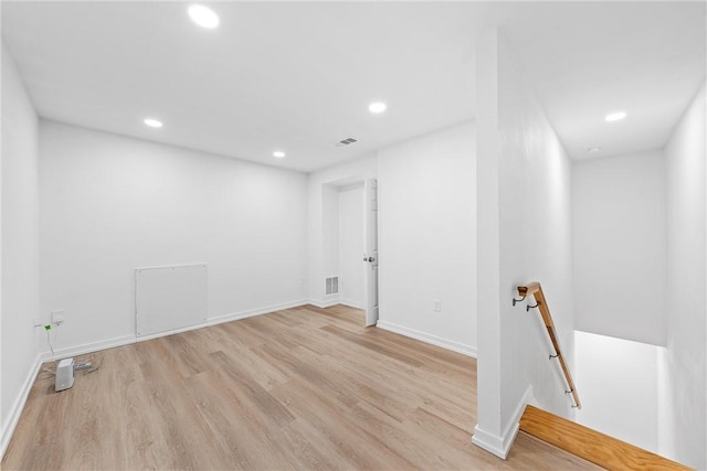 spare room featuring light hardwood / wood-style flooring