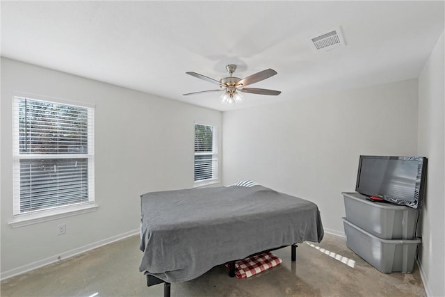 bedroom with multiple windows and ceiling fan