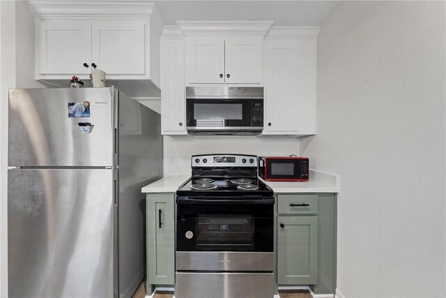 kitchen featuring white cabinetry and appliances with stainless steel finishes