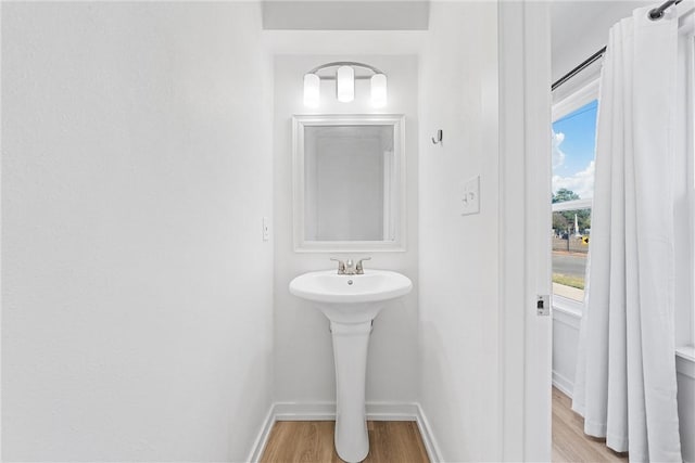 bathroom featuring sink and hardwood / wood-style flooring