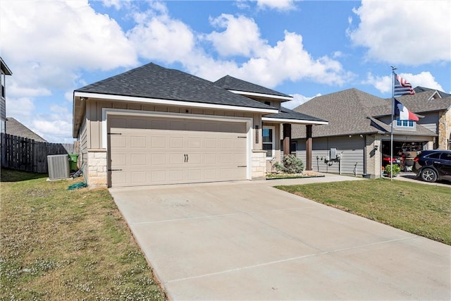 view of front facade featuring a garage, a front lawn, and cooling unit