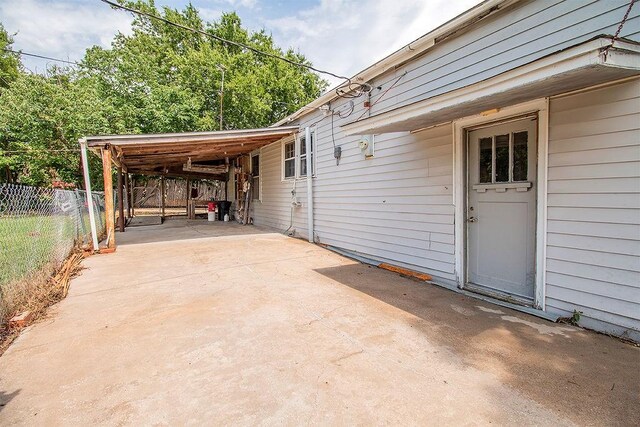 view of patio featuring a carport