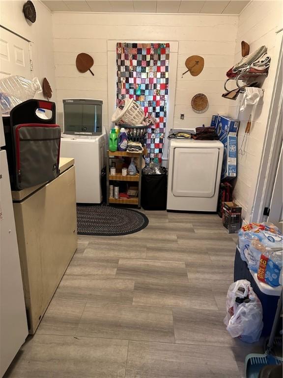 laundry room featuring light hardwood / wood-style flooring