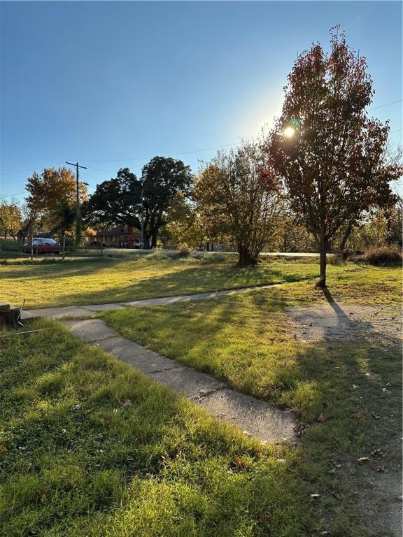 view of property's community with a yard