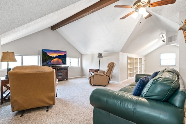 living room with a textured ceiling, lofted ceiling with beams, light colored carpet, and ceiling fan