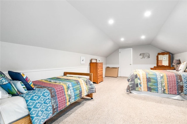 carpeted bedroom with vaulted ceiling