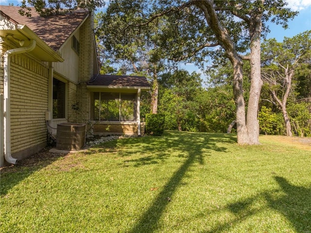 view of yard with central AC