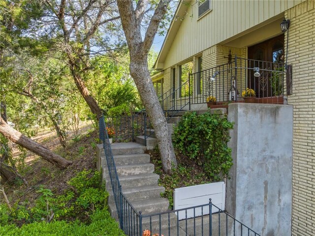 view of side of property with a balcony