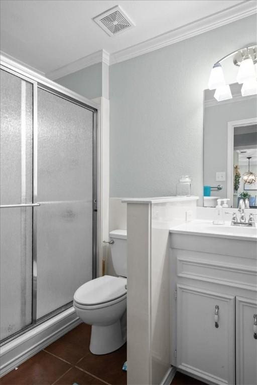 bathroom featuring vanity, visible vents, tile patterned flooring, a shower stall, and crown molding