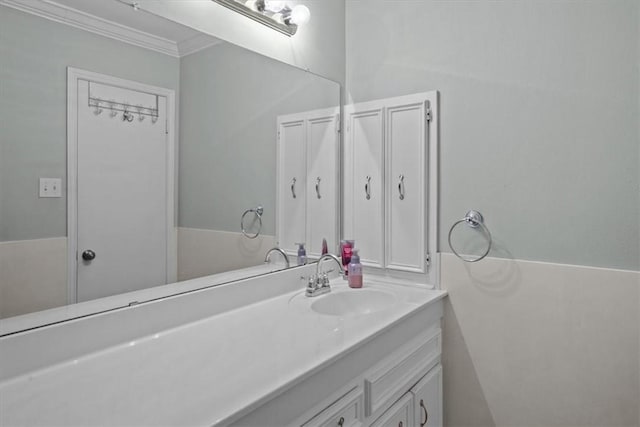 bathroom with vanity and crown molding