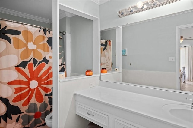 full bathroom with vanity, crown molding, and curtained shower