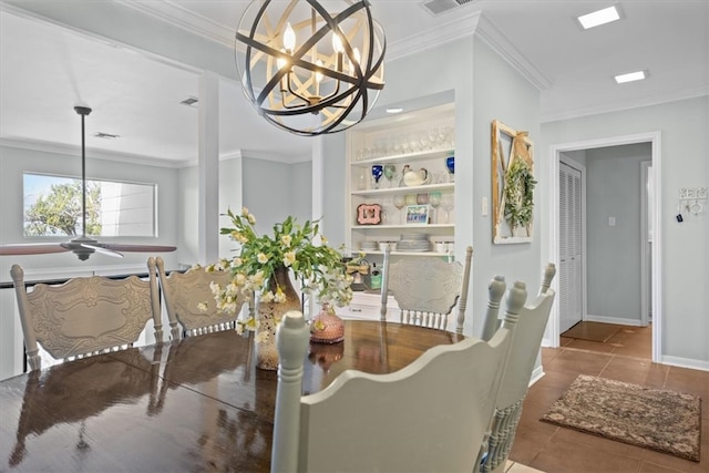 tiled dining room with built in shelves, visible vents, baseboards, crown molding, and a notable chandelier