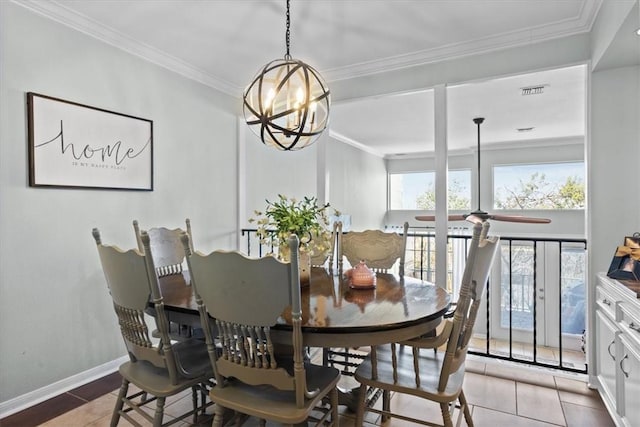 dining space with a chandelier, baseboards, and ornamental molding