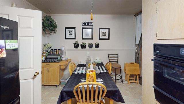 dining area with crown molding