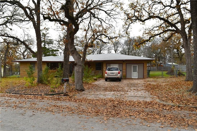 ranch-style house featuring a garage