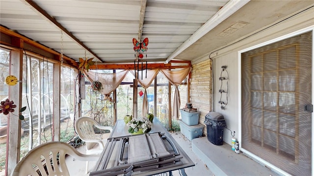 sunroom with beamed ceiling