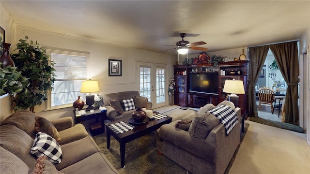 living room featuring ceiling fan, light carpet, and french doors