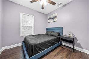 bedroom featuring ceiling fan and dark hardwood / wood-style flooring