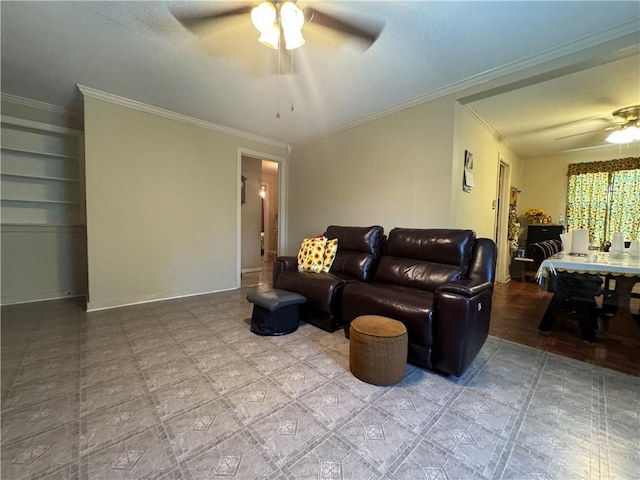 living room with ceiling fan and ornamental molding