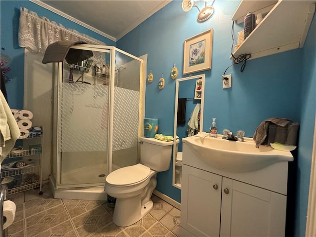 bathroom with tile patterned flooring, crown molding, toilet, a shower with door, and vanity