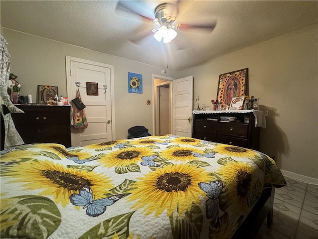 bedroom featuring tile patterned floors and ceiling fan