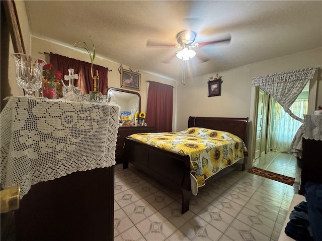 bedroom featuring ceiling fan and light tile patterned floors