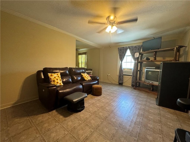 living room featuring a textured ceiling, ceiling fan, and crown molding