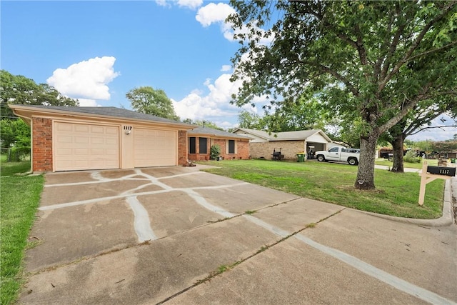 ranch-style home featuring a garage and a front yard