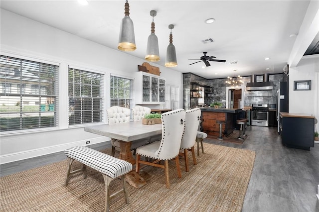 dining area featuring dark hardwood / wood-style floors and ceiling fan