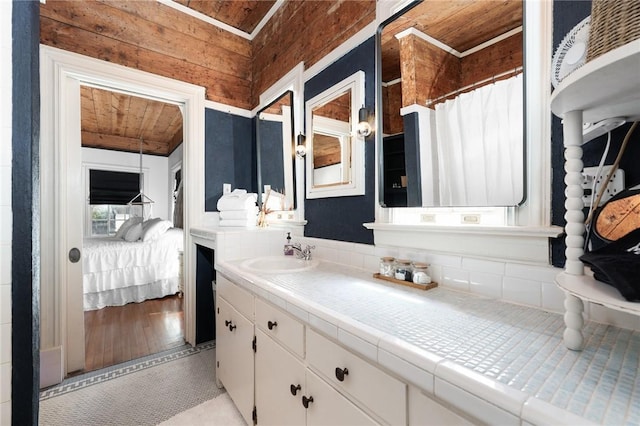 bathroom with vanity, wood-type flooring, wooden ceiling, and wooden walls