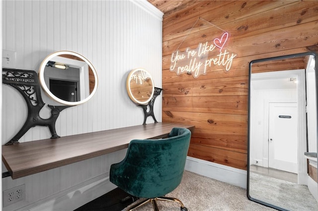 carpeted office featuring wood walls