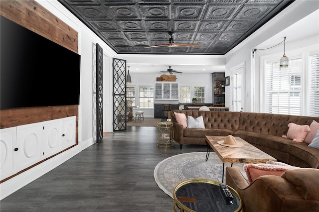 living room with ceiling fan, dark hardwood / wood-style flooring, and a wealth of natural light