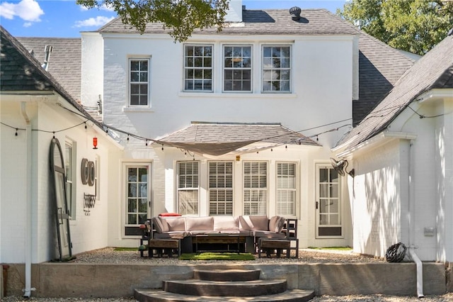 back of property featuring outdoor lounge area