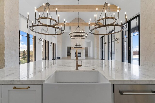 kitchen featuring decorative backsplash, white cabinets, double oven range, and light hardwood / wood-style floors