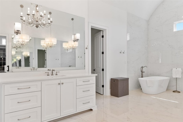 bathroom with a washtub, vanity, vaulted ceiling, tile walls, and a notable chandelier