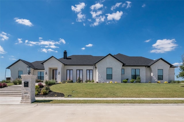 view of front of home with a front yard