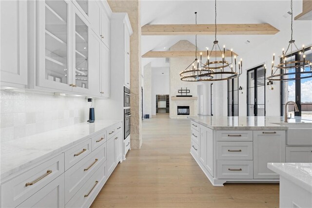 dining room featuring a notable chandelier, plenty of natural light, and light hardwood / wood-style floors